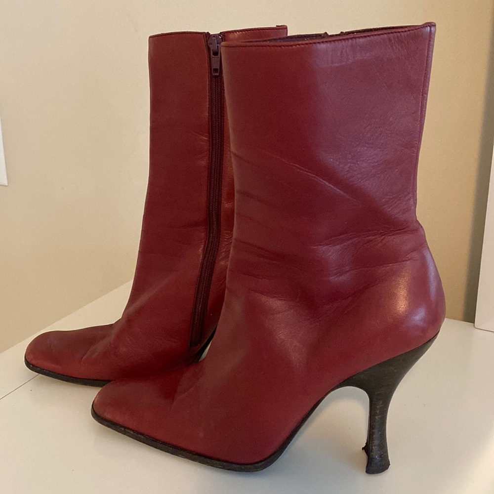 Authentic Prada mid calf boots with stacked sculpted heel.